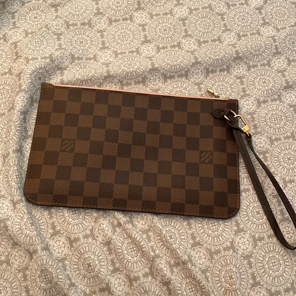 Louis Vuitton wristlet, clutch. Used twice. In PERFECT condition.
